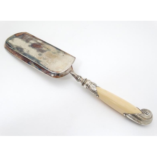 554 - A Victorian silver crumb scoop with silver mounted ivory handle hallmarked Sheffield 1888 maker Harr... 