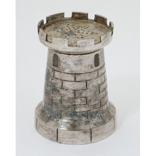 558 - A novelty pepperette / pounce pot formed as a castellated turret 2 1/2'' high