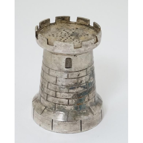 558 - A novelty pepperette / pounce pot formed as a castellated turret 2 1/2'' high