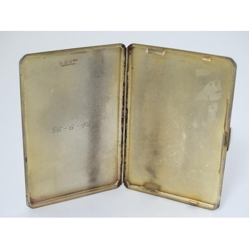 568 - An Art Deco silver cigarette case with engine turned decoration, Hallmarked Birmingham 1946 maker W ... 