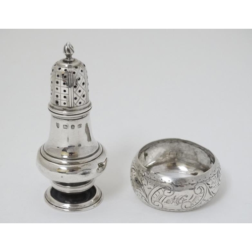 571 - A silver pepperette hallmarked Birmingham 1895 maker Haseler Brothers together with a silver napkin ... 