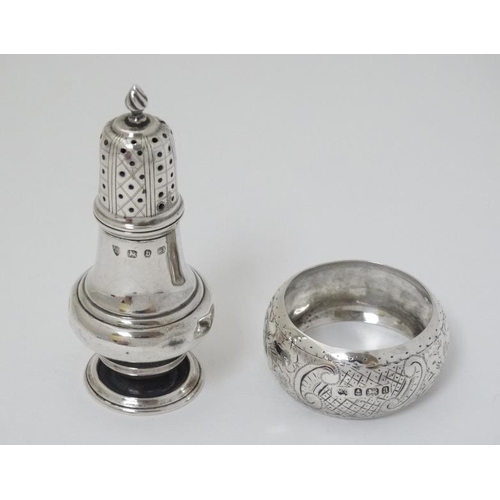 571 - A silver pepperette hallmarked Birmingham 1895 maker Haseler Brothers together with a silver napkin ... 