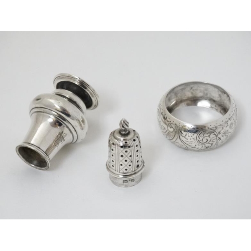 571 - A silver pepperette hallmarked Birmingham 1895 maker Haseler Brothers together with a silver napkin ... 