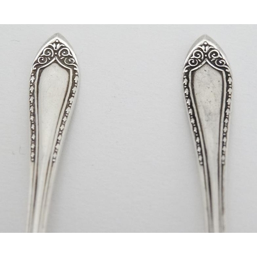 575 - A pair of silver coffee spoons hallmarked Birmingham 1931 maker Mappin & Webb Ltd 3 3/4'' long (18g)