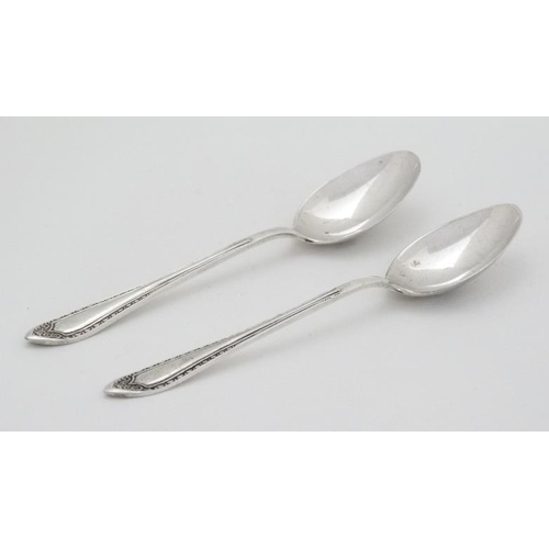 575 - A pair of silver coffee spoons hallmarked Birmingham 1931 maker Mappin & Webb Ltd 3 3/4'' long (18g)