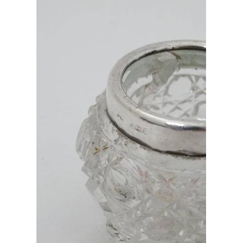 577 - A cut glass salt with silver rim hallmarked rim London 1910 together with 3 silver spoons hallmarked... 