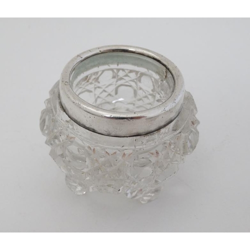 577 - A cut glass salt with silver rim hallmarked rim London 1910 together with 3 silver spoons hallmarked... 