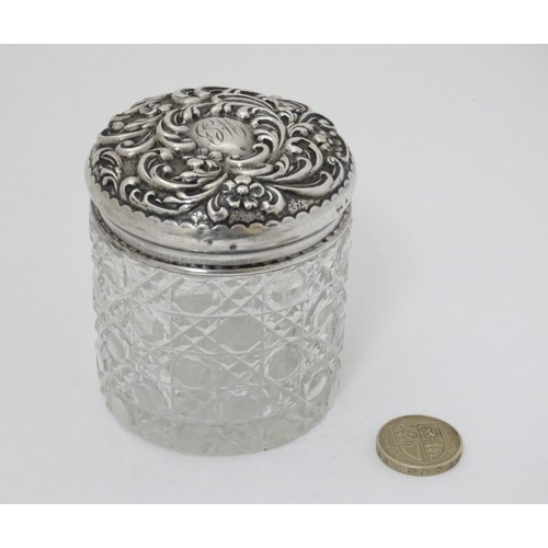 581 - A cut glass dressing table pot with silver top hallmarked London 1905 maker JB 3''  high