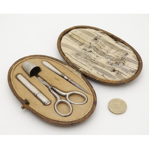 582 - A necessarie / etui containing French white metal needle / bodkin case,  together with scissors thim... 