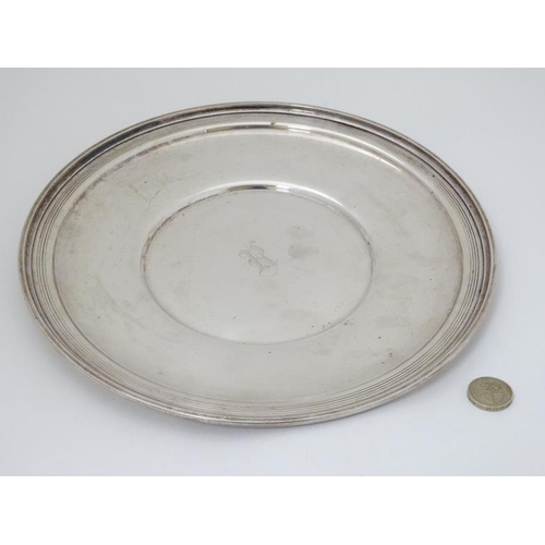 583 - A silver dish/ plate marked Sterling and marked Marie Louise 10 1/4''  diameter (380g)