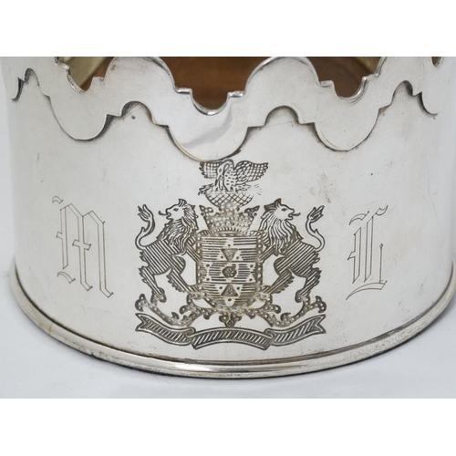 584 - A silver plate bottle coaster with engraved crest and wooden base 3'' high x 4 1/4''