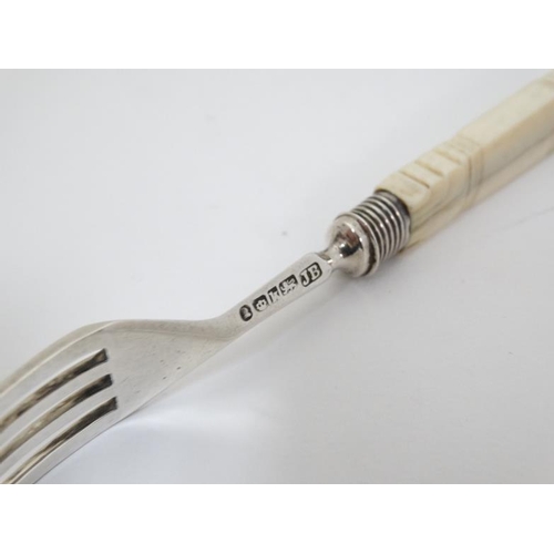 595 - A Wm IV silver fruit knife and fork with carved ivory handles. Hallmarked Sheffield 1832 maker J.B. ... 