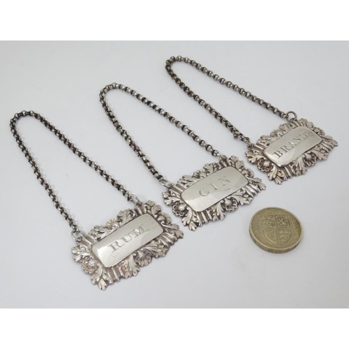 599 - Bottle tickets / Wine labels  : A silver wine label marked ' 'RUM' hallmarked Birmingham 1829  maker... 