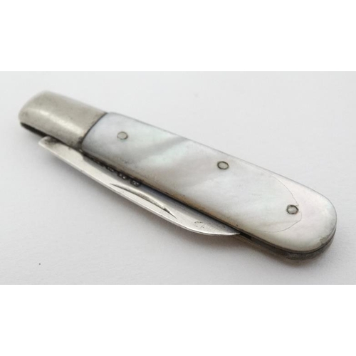 600 - A small mother of pearl folding fruit knife with mother of pearl handle and silver blade hallmarked ... 