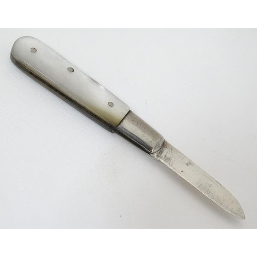 600 - A small mother of pearl folding fruit knife with mother of pearl handle and silver blade hallmarked ... 