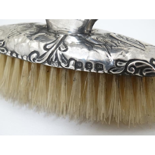 602 - A silver mounted nail brush hallmarked Birmingham 1899 maker Levi & Salaman together with a silver m... 