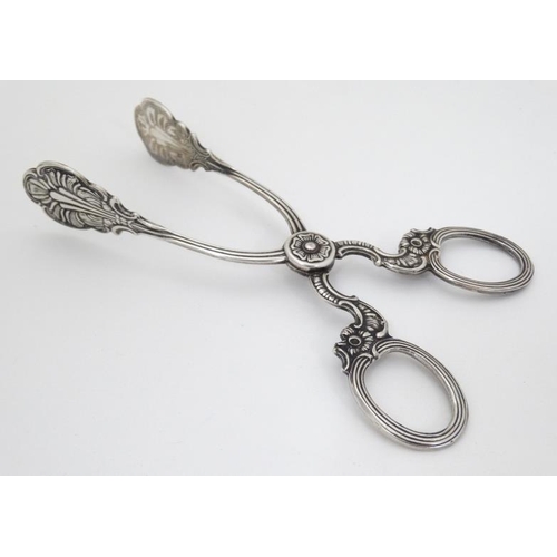 604 - Silver plate sugar nips with cast decoration 5 1/2'' long