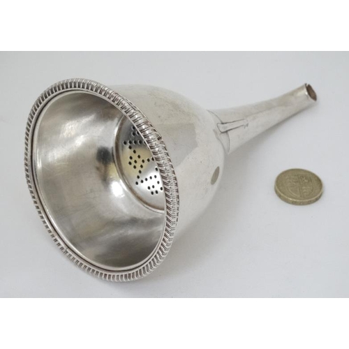 606 - A 19thC silver plated wine funnel with strainer section 6'' long