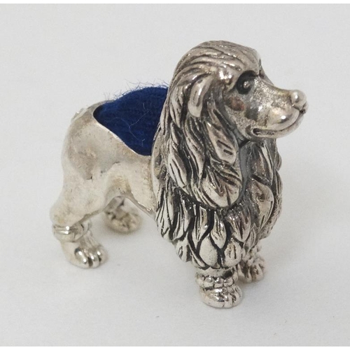 607 - A .925 silver novelty miniature pin cushion formed as a poodle dog. 21stC . 1'' long