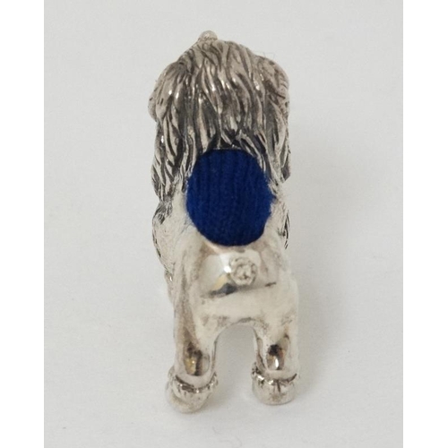 607 - A .925 silver novelty miniature pin cushion formed as a poodle dog. 21stC . 1'' long