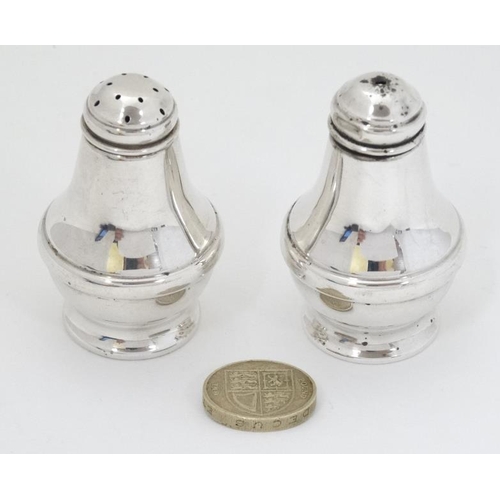 611 - A silver salt and pepper cruet hallmarked Birmingham 1995/96 maker L J Millington. Approx 2'' high (... 