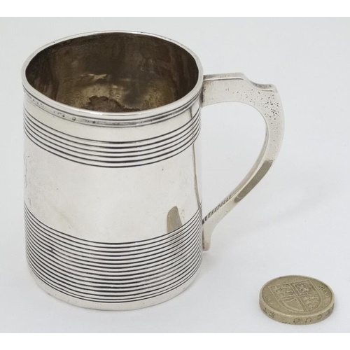 618 - A Geo III silver Christening mug hallmarked London 1811 maker SH. approx 2 1/2'' high (92g)