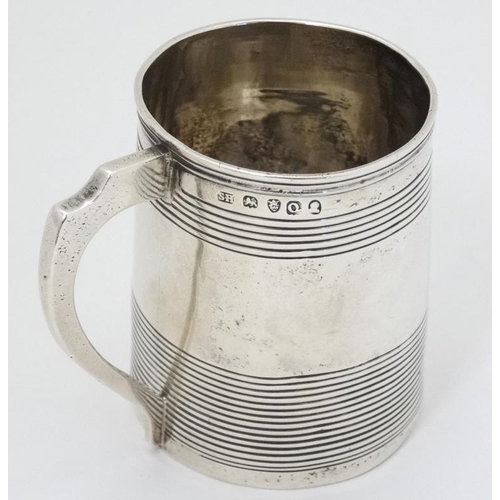 618 - A Geo III silver Christening mug hallmarked London 1811 maker SH. approx 2 1/2'' high (92g)