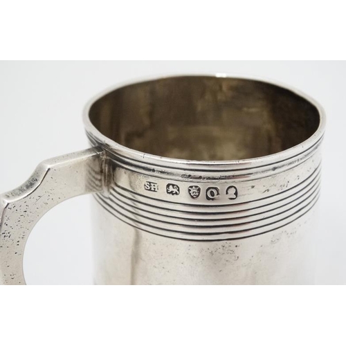 618 - A Geo III silver Christening mug hallmarked London 1811 maker SH. approx 2 1/2'' high (92g)