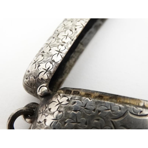 622 - A large silver vesta case with engraved foliate decoration, hinged lid and striker under. Hallmarked... 