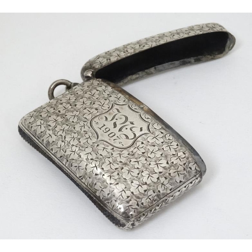 622 - A large silver vesta case with engraved foliate decoration, hinged lid and striker under. Hallmarked... 