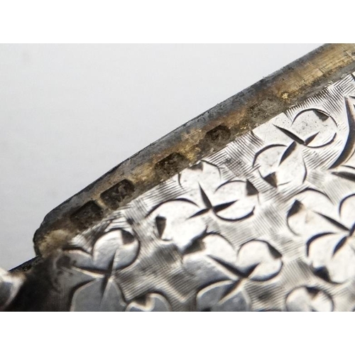 622 - A large silver vesta case with engraved foliate decoration, hinged lid and striker under. Hallmarked... 