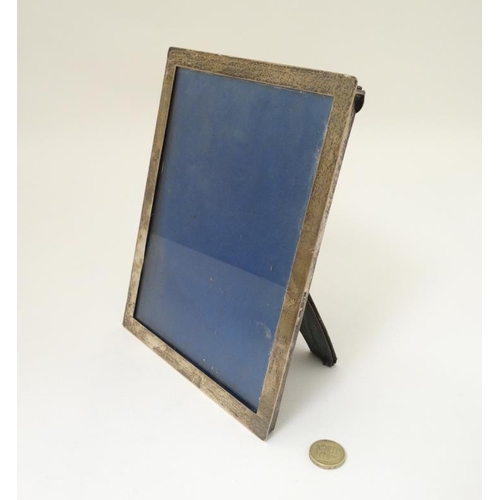 628 - A silver photograph frame with ease/strut back, hallmarked Chester 1911 maker Stokes & Ireland Ltd. ... 