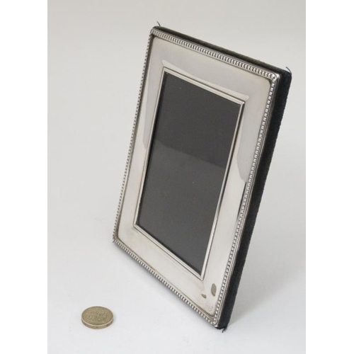 637 - A silver photograph frame with easel / strut back Hallmarked Sheffield 1997 maker Carr's of Sheffiel... 