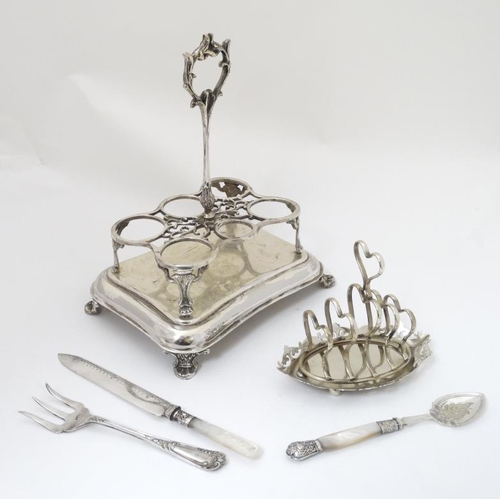 638 - Assorted silver plated wares comprising cruet frame / stand, toast rack, mother of pearl handled bre... 