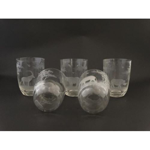 650 - A set of 5 glass tumblers decorated with various African wildlife to include cape buffalo, elephant,... 