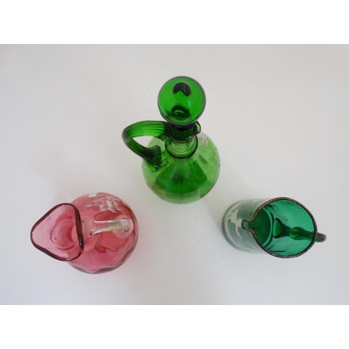 659 - Mary Gregory : 3 various items of Mary Gregory glass to include a cranberry glass jug, green glass j... 