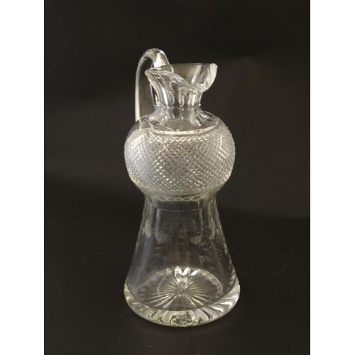 664 - A Scottish cut crystal jug of stylised thistle form approx 9'' high