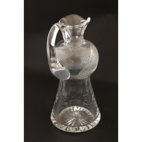 664 - A Scottish cut crystal jug of stylised thistle form approx 9'' high