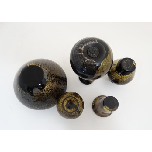 667 - Studio / Art glass : 5 various glass vases dark ground with iridescent gilt like finish. one indisti... 