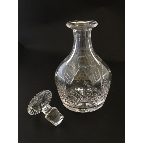 671 - A glass decanter and stopper 9'' high