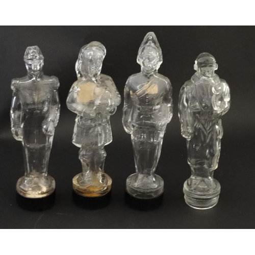 684 - 4 glass jars formed as various military figures, 3 having Bakelite screw bases. Approx 7'' high