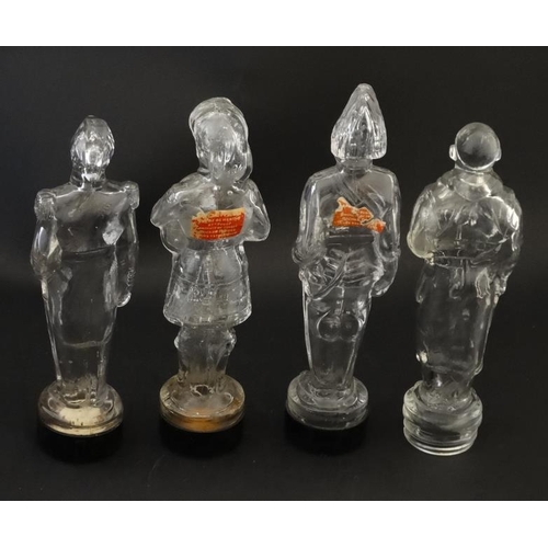 684 - 4 glass jars formed as various military figures, 3 having Bakelite screw bases. Approx 7'' high