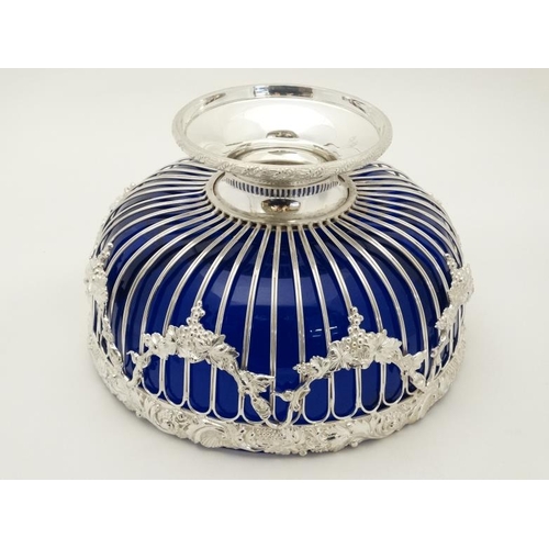 695 - A late 20thC / early 21st silver plated pedestal bowl with blue glass liner approx 11'' diameter  x ... 