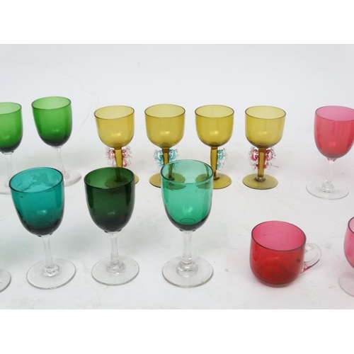 697 - Assorted glass ware - various coloured  drinking glasses to include  beakers, wine glasses etc ( app... 