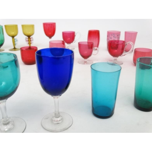 697 - Assorted glass ware - various coloured  drinking glasses to include  beakers, wine glasses etc ( app... 