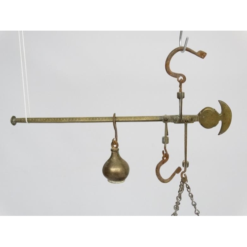 701 - Old brass hanging scales with large pan to one end and weight to other. The pan 14'' wide