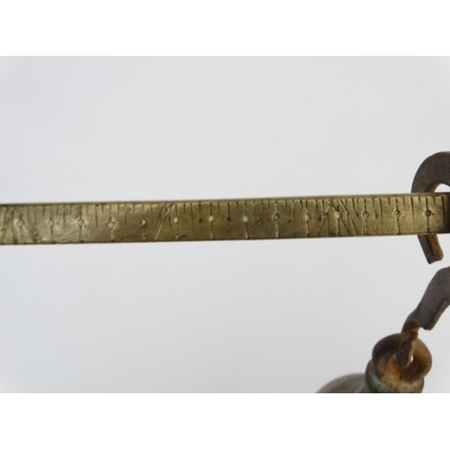 701 - Old brass hanging scales with large pan to one end and weight to other. The pan 14'' wide