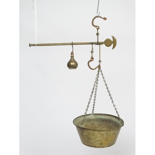 701 - Old brass hanging scales with large pan to one end and weight to other. The pan 14'' wide