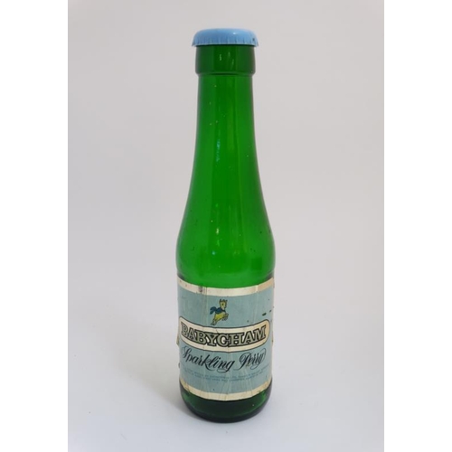 720 - Advertising: a Babycham Bottle, the cap with a money box hole, standing approximately 17'' high