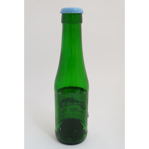 720 - Advertising: a Babycham Bottle, the cap with a money box hole, standing approximately 17'' high